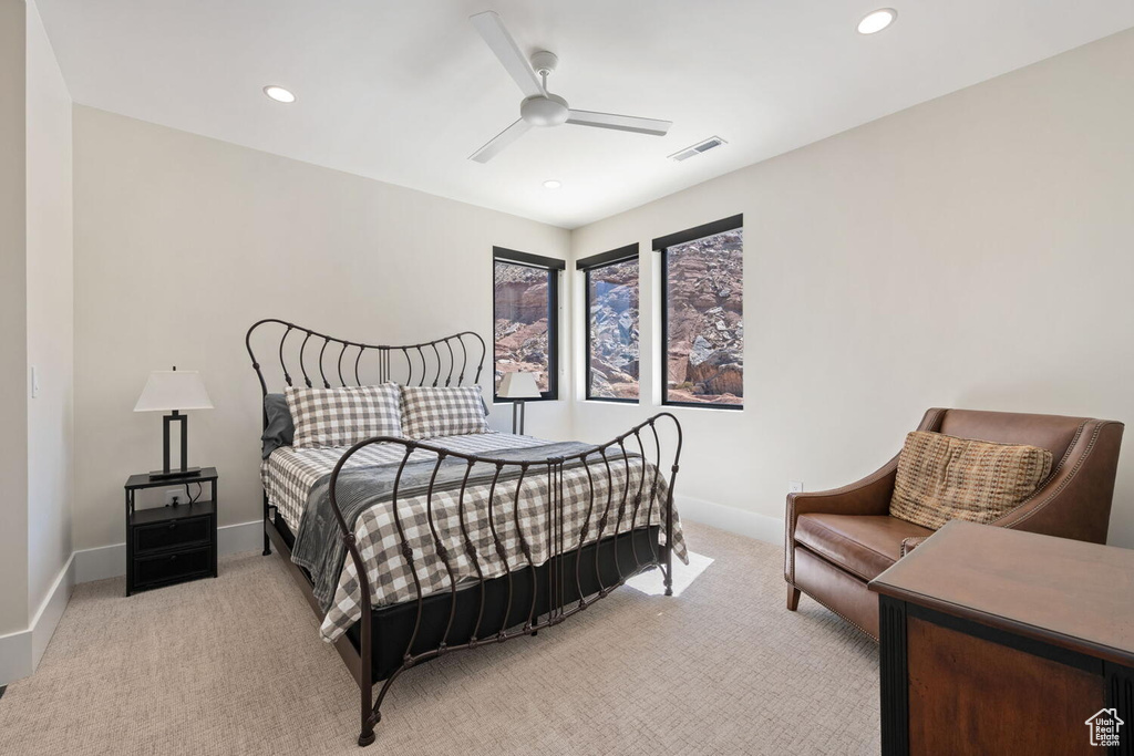 Bedroom with light carpet, recessed lighting, and ceiling fan