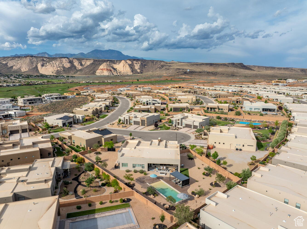 Aerial view of residential area featuring a mountain backdrop