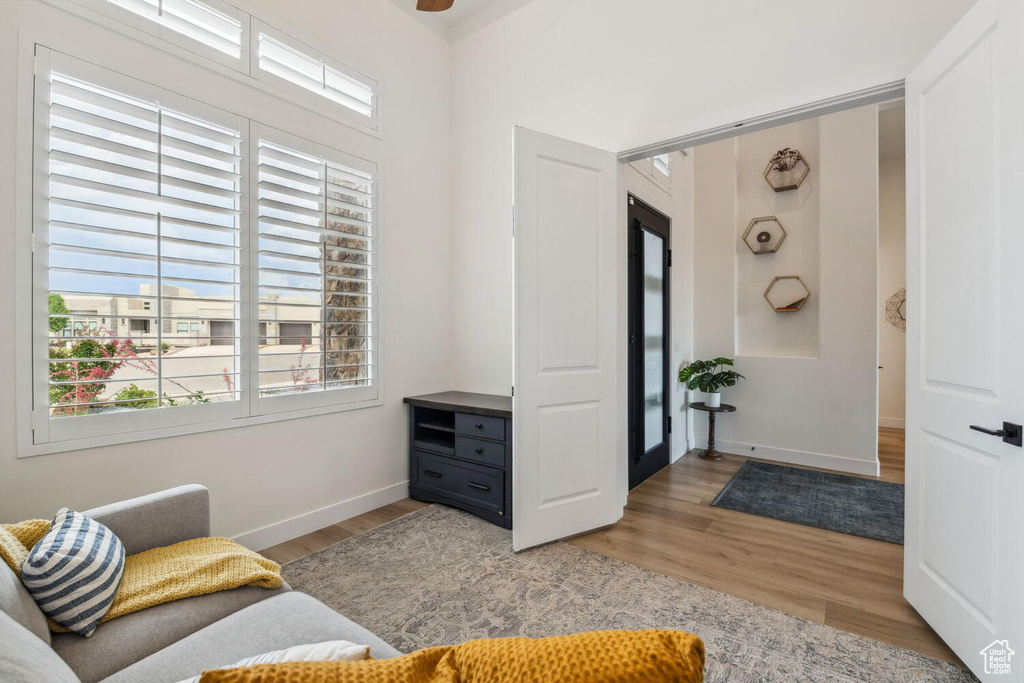 Living area with light wood-type flooring and baseboards
