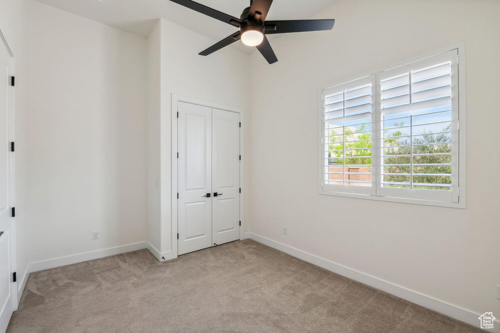 Unfurnished bedroom with carpet floors and a closet