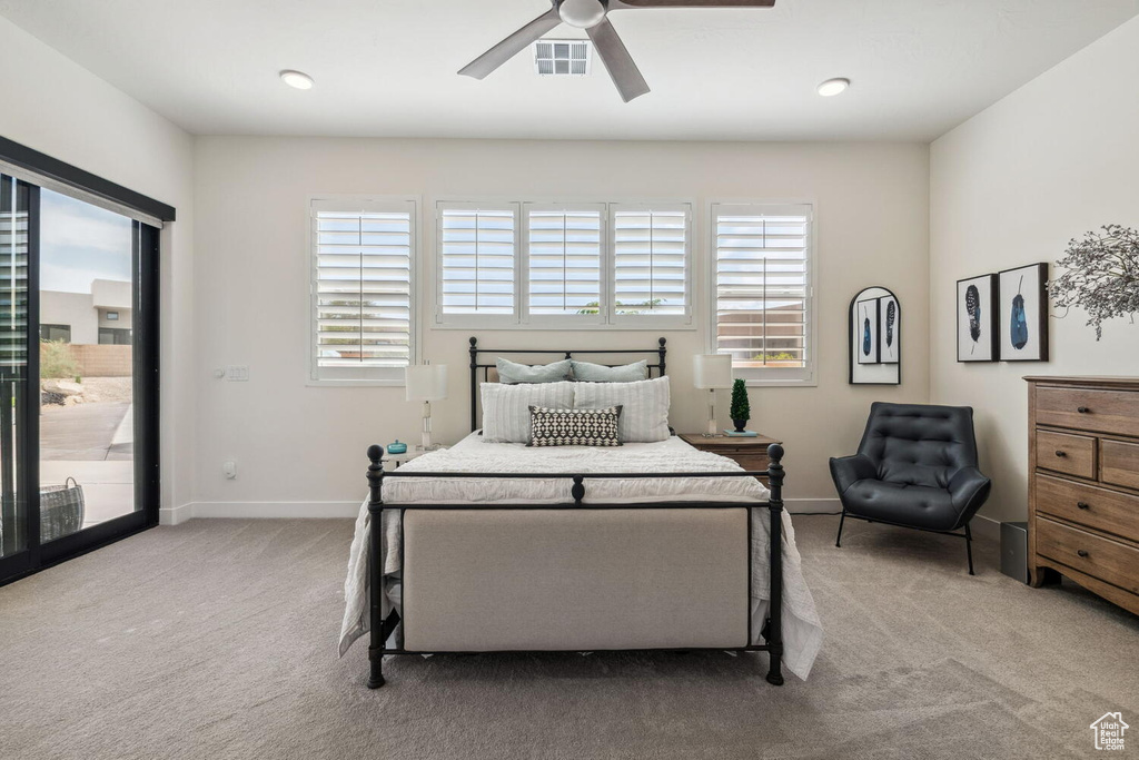 Bedroom featuring carpet floors, multiple windows, access to exterior, and ceiling fan