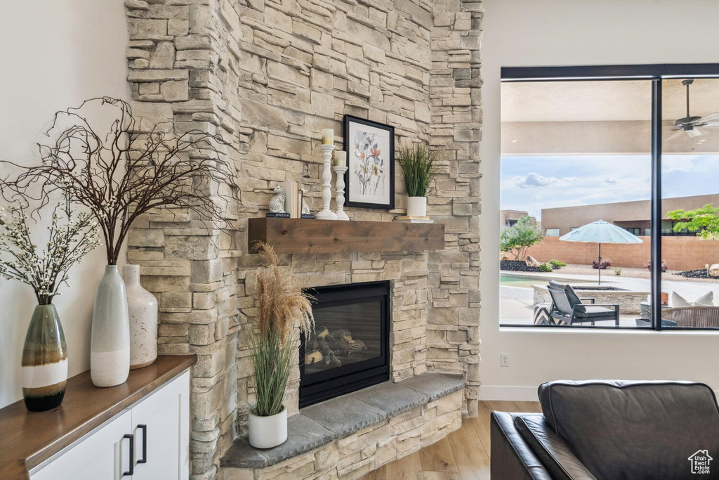 Living area featuring wood finished floors and a fireplace