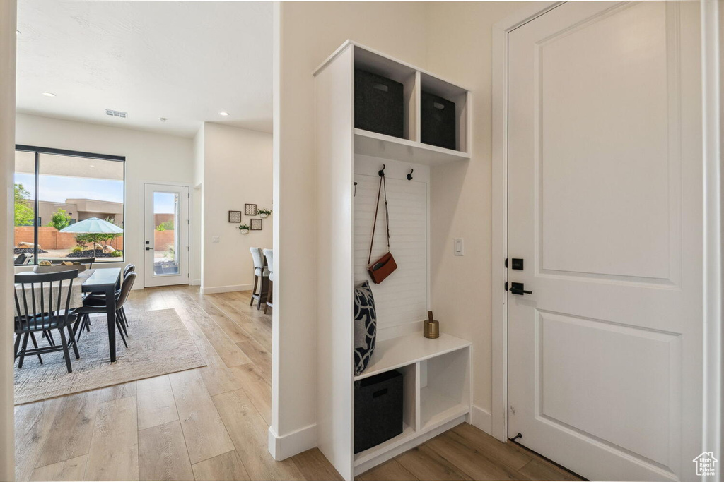 Mudroom featuring light wood-type flooring and recessed lighting