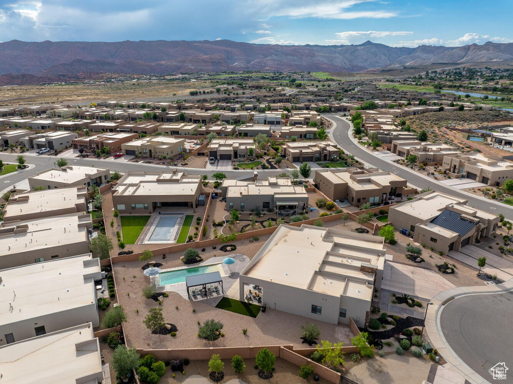 Aerial view of residential area with a mountainous background