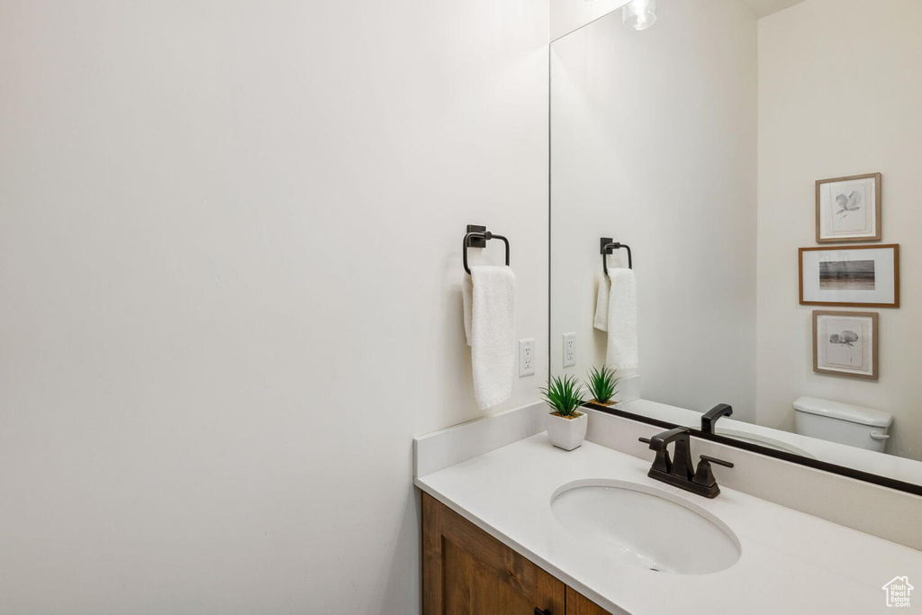 Bathroom with vanity and toilet