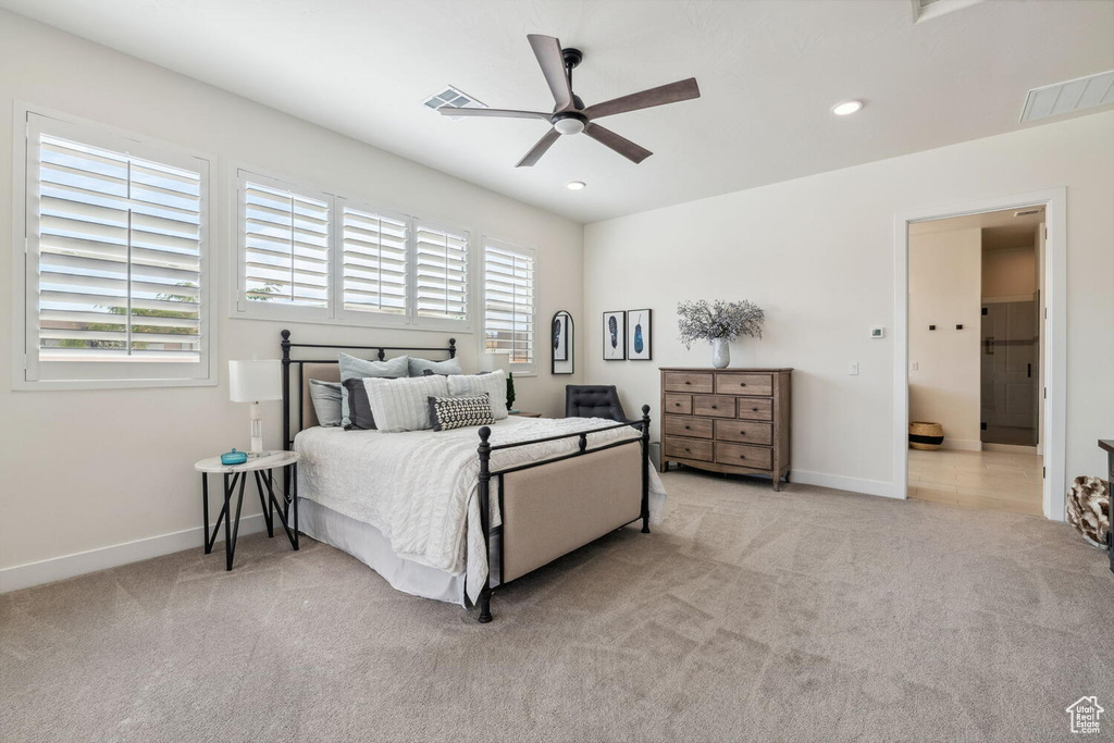 Carpeted bedroom with recessed lighting and a ceiling fan