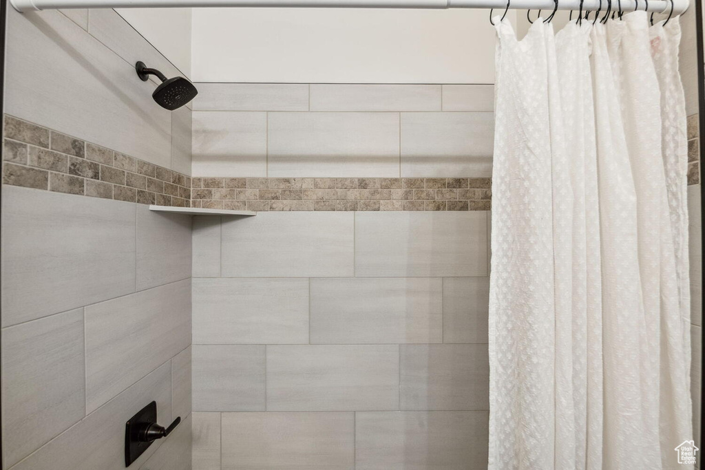 Bathroom with tiled shower
