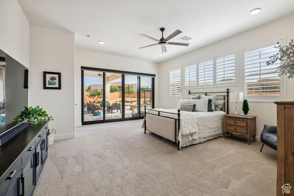 Bedroom featuring access to outside, light carpet, a ceiling fan, and recessed lighting