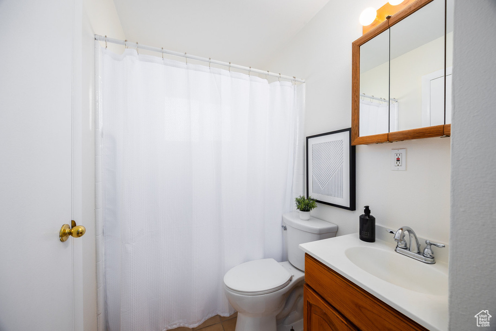 Bathroom featuring toilet and vanity