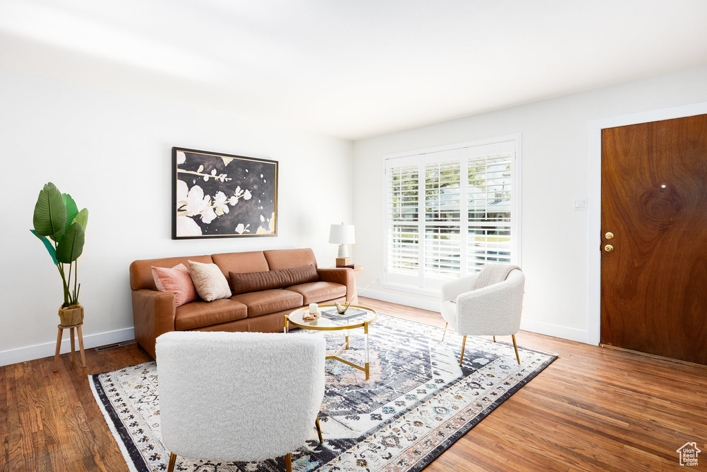 Living area featuring wood finished floors and baseboards