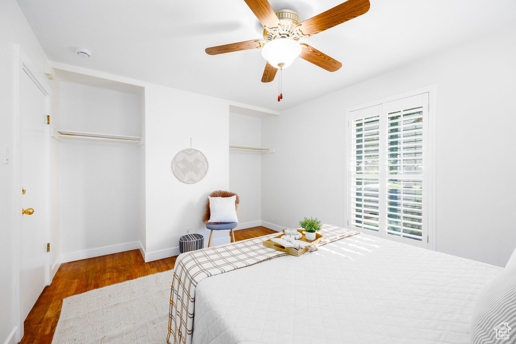 Bedroom with wood finished floors and ceiling fan