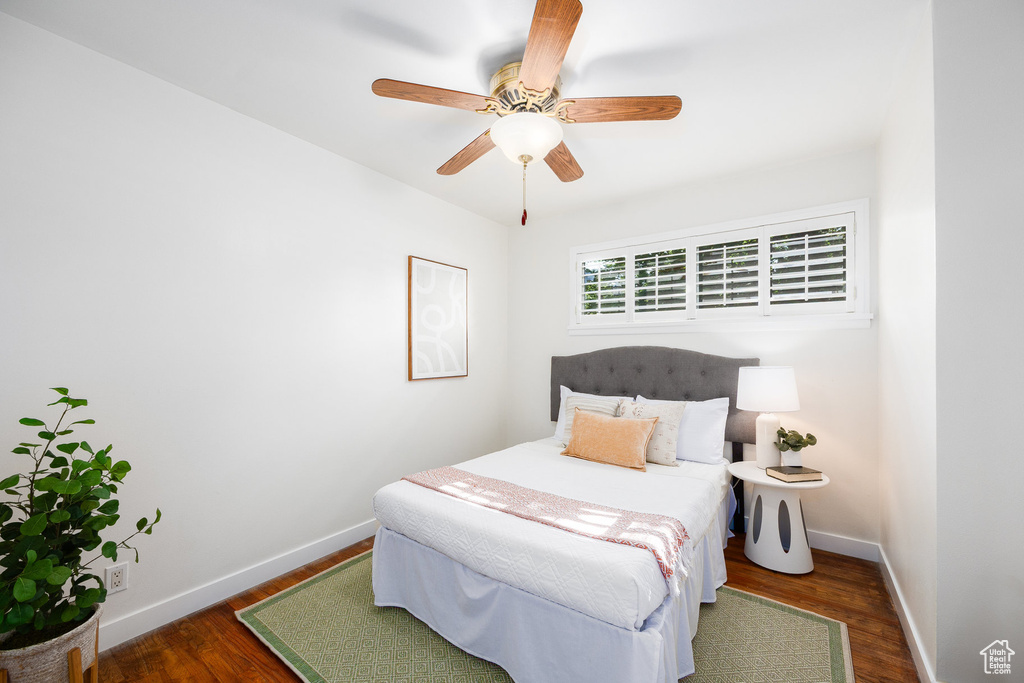 Bedroom featuring wood finished floors and ceiling fan