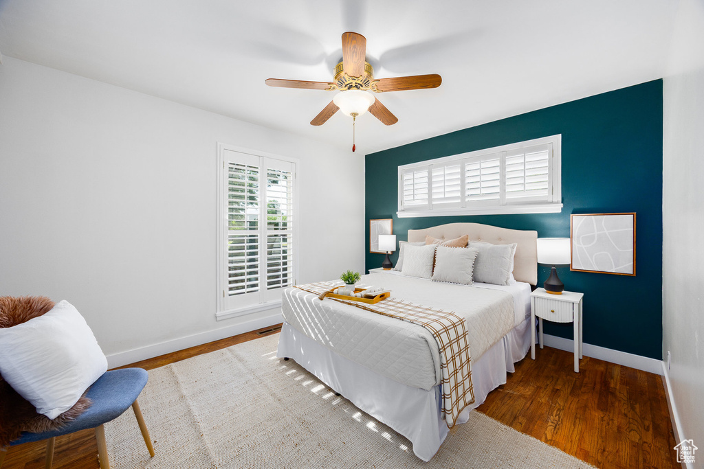 Bedroom featuring wood finished floors and ceiling fan