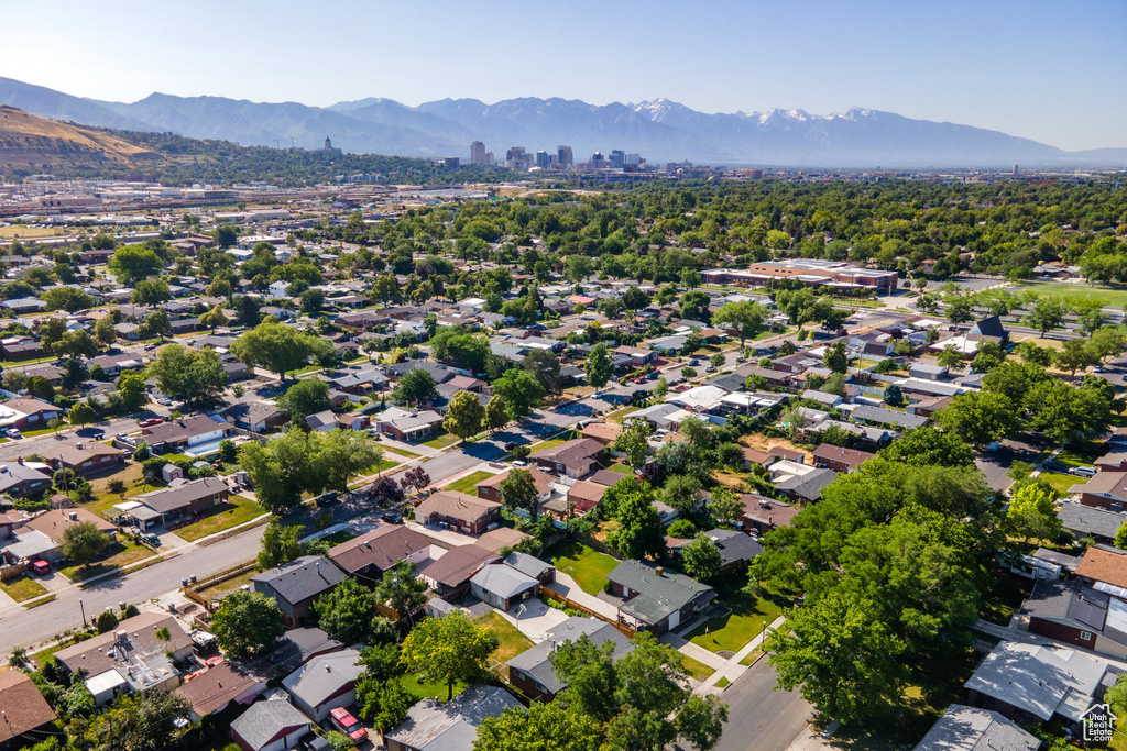 Aerial overview of property's location featuring a mountainous background