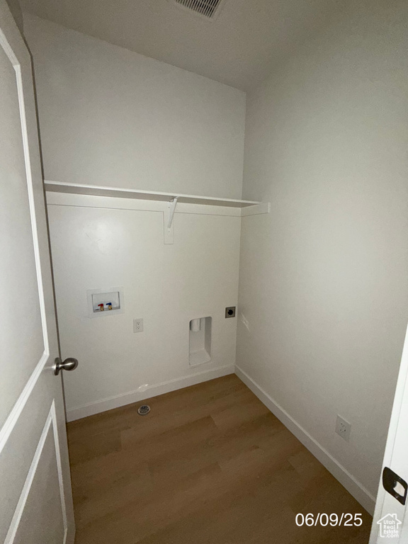 Washroom with washer hookup, wood finished floors, electric dryer hookup, and baseboards
