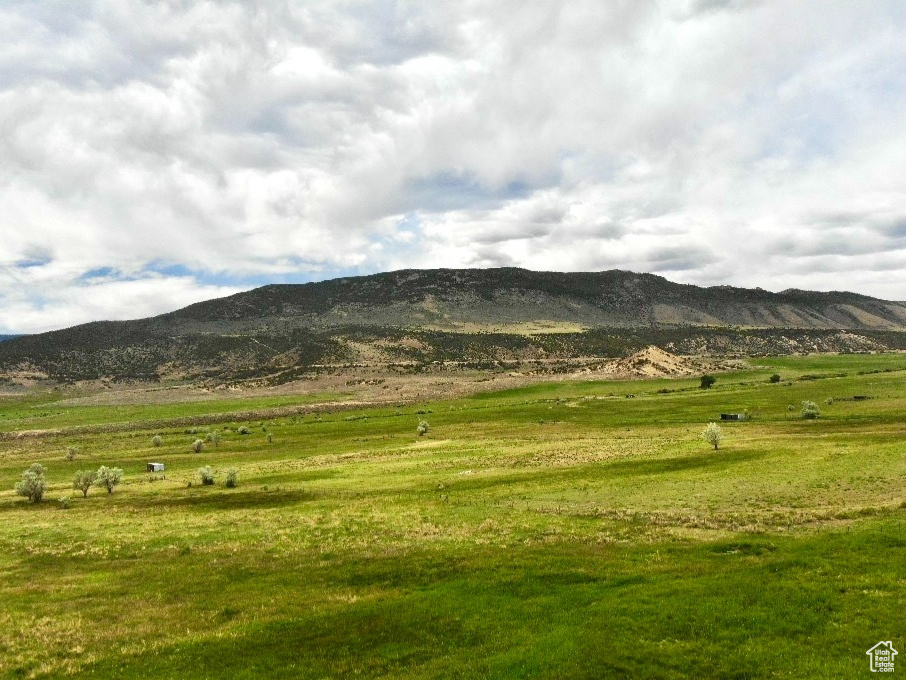View of mountain background featuring rural landscape