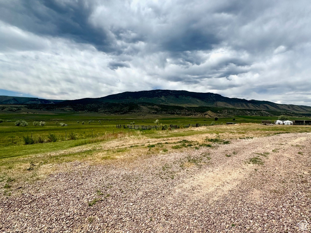 View of mountain backdrop with rural landscape