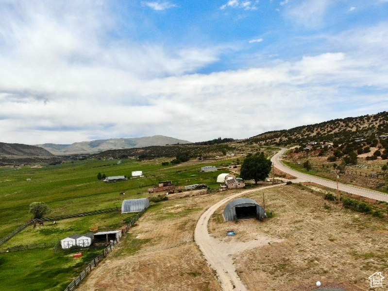 Aerial view of sparsely populated area with a mountain backdrop