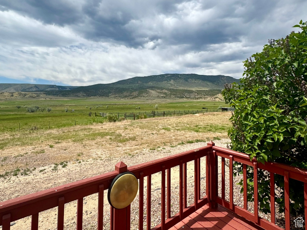 Wooden terrace with a view of countryside and a mountain view
