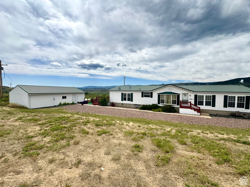 Back of property with a metal roof