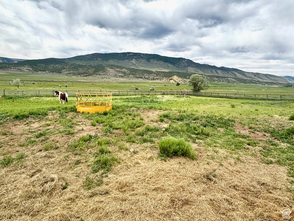 View of mountain backdrop with rural landscape and a pastoral area