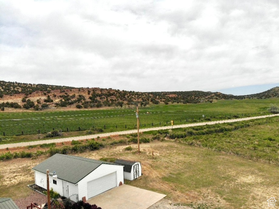 View of mountain backdrop featuring rural landscape