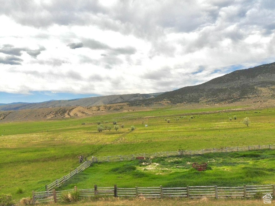 View of mountain background featuring rural landscape and agricultural land