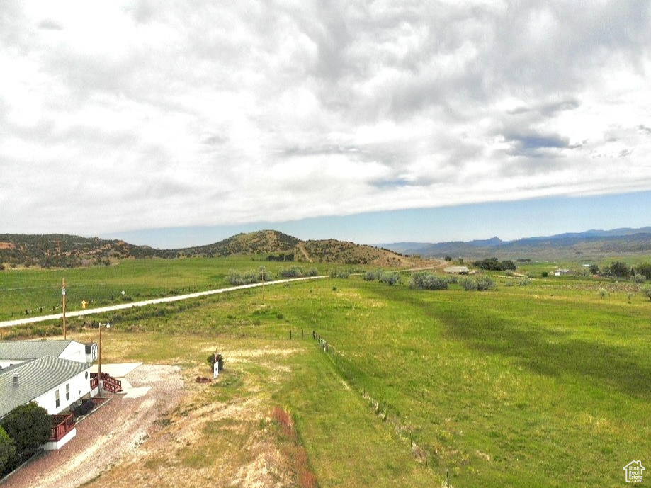 View of mountain backdrop with rural landscape
