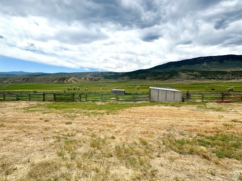 View of yard featuring a view of countryside and an outbuilding