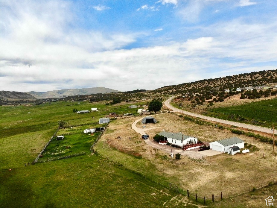 Overview of rural landscape with a mountain backdrop