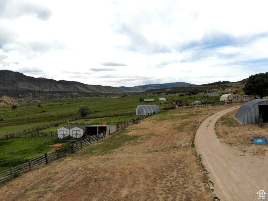View of mountain backdrop with rural landscape and a pastoral area