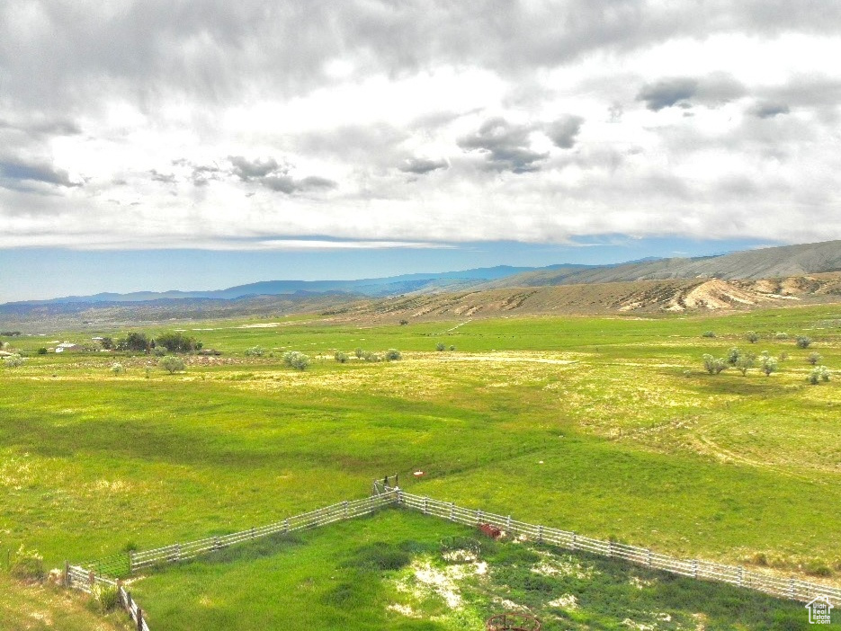 Overview of rural landscape with a mountain backdrop