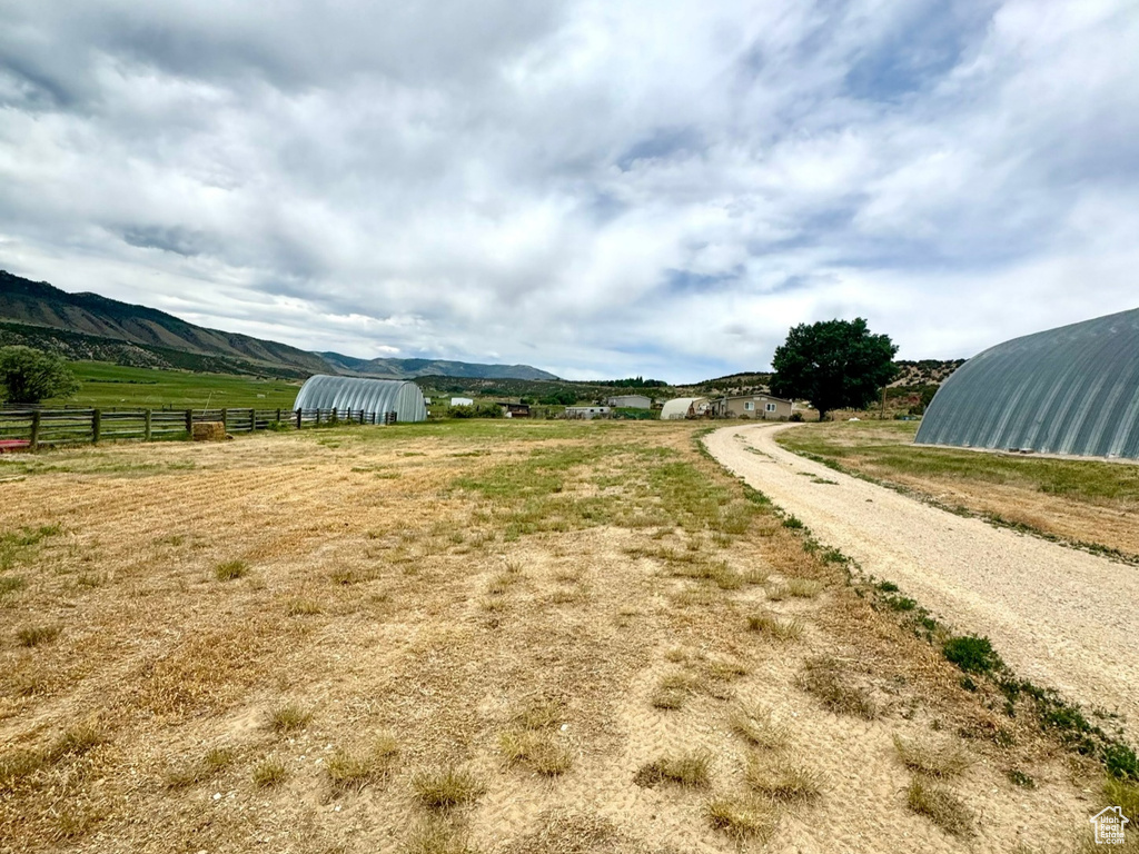 View of dirt / gravel road with a view of countryside