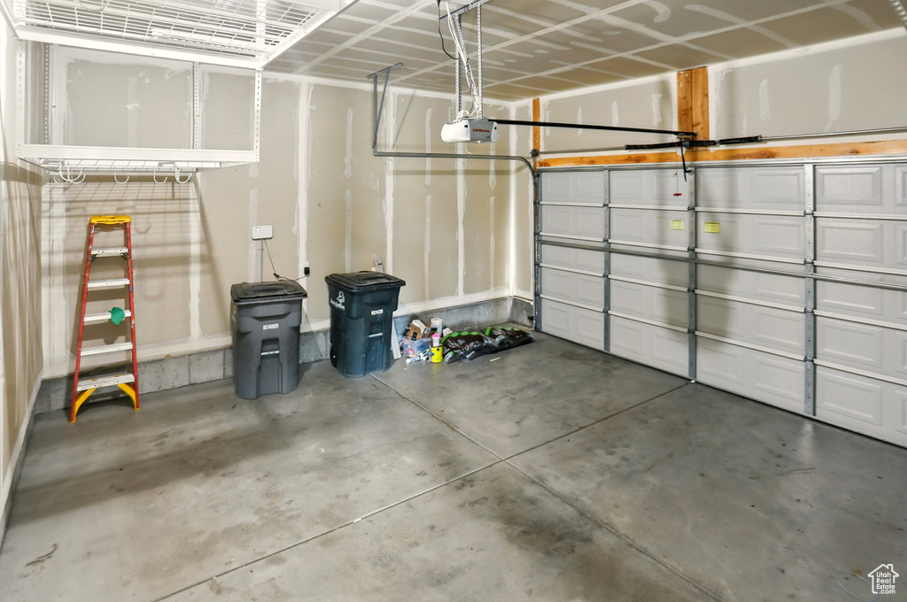 Garage featuring a garage door opener