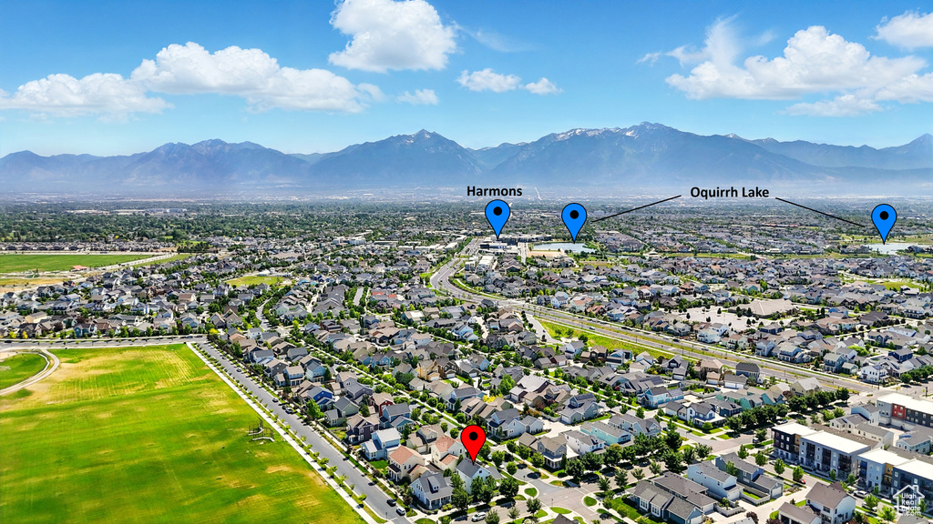 Aerial perspective of suburban area with a mountainous background