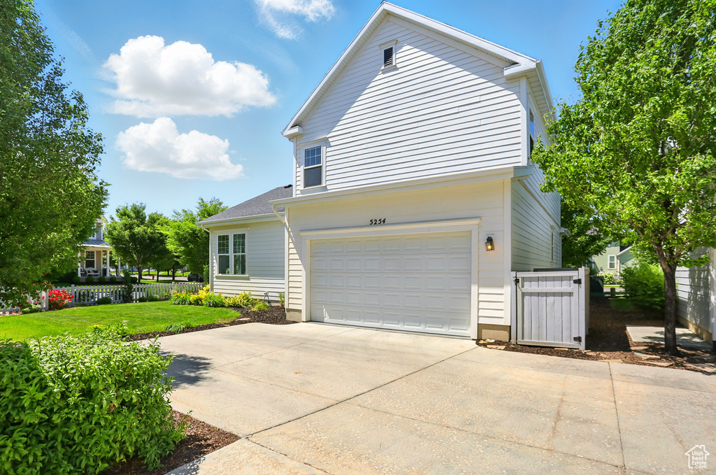 View of front of home featuring a garage and driveway