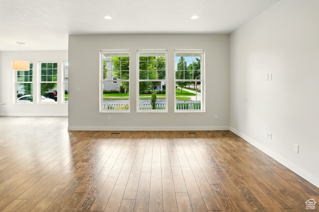 Unfurnished living room with hardwood / wood-style floors