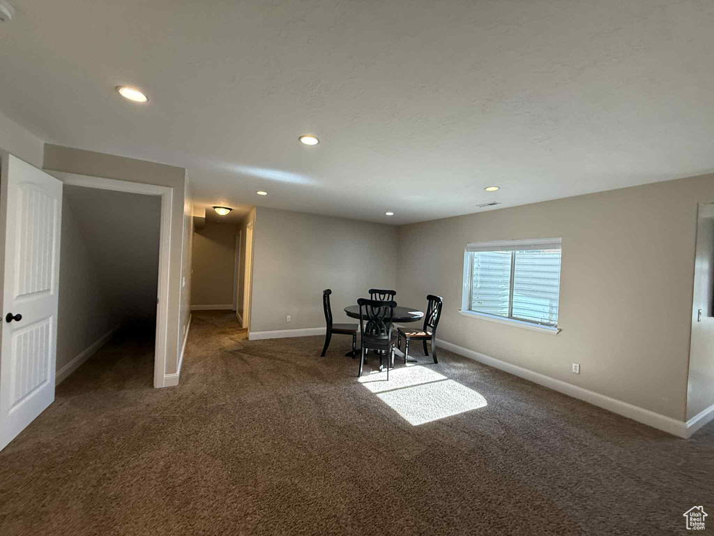 Dining area with carpet floors and recessed lighting