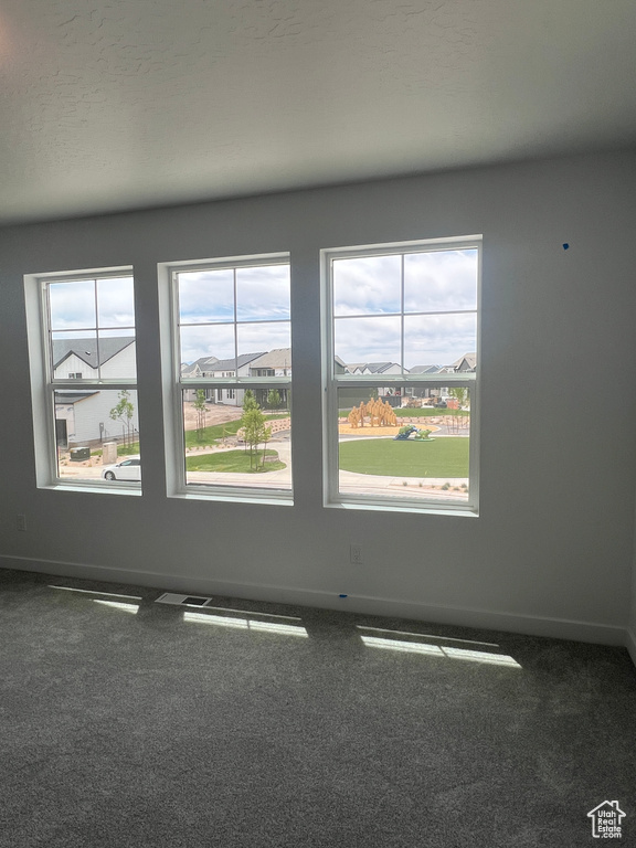 Empty room with baseboards and carpet floors