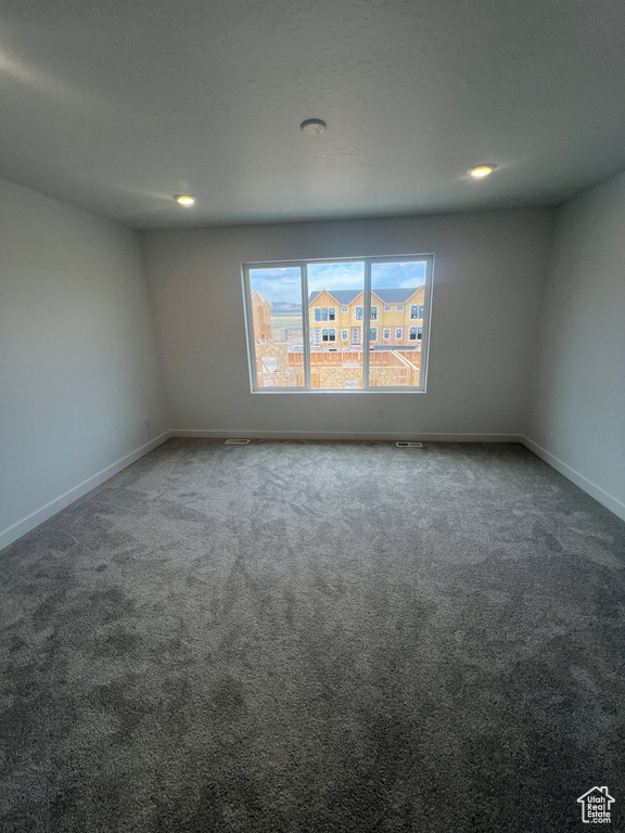 Spare room with carpet floors and recessed lighting
