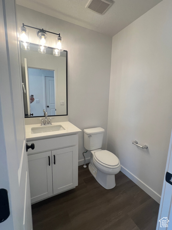 Bathroom featuring vanity and wood finished floors