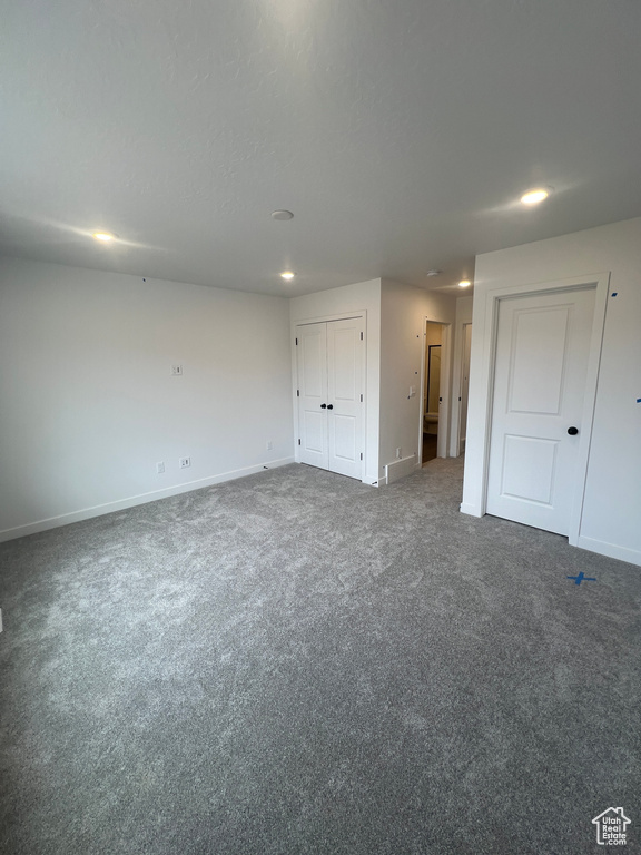 Unfurnished bedroom with recessed lighting and carpet floors