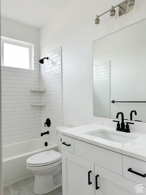 Full bath with vanity, shower / washtub combination, and tile patterned flooring