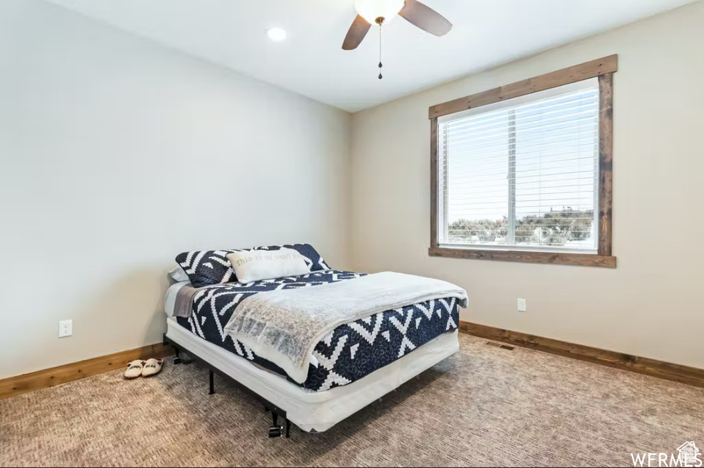 Bedroom featuring baseboards and a ceiling fan