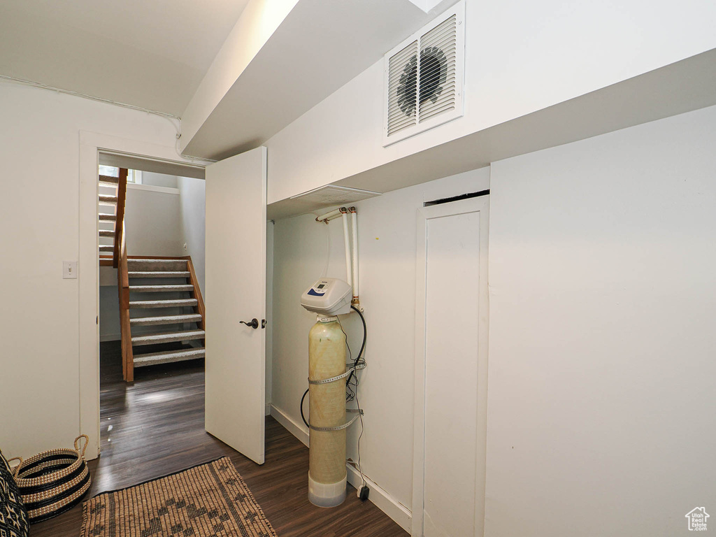Below grade area featuring stairs and wood finished floors