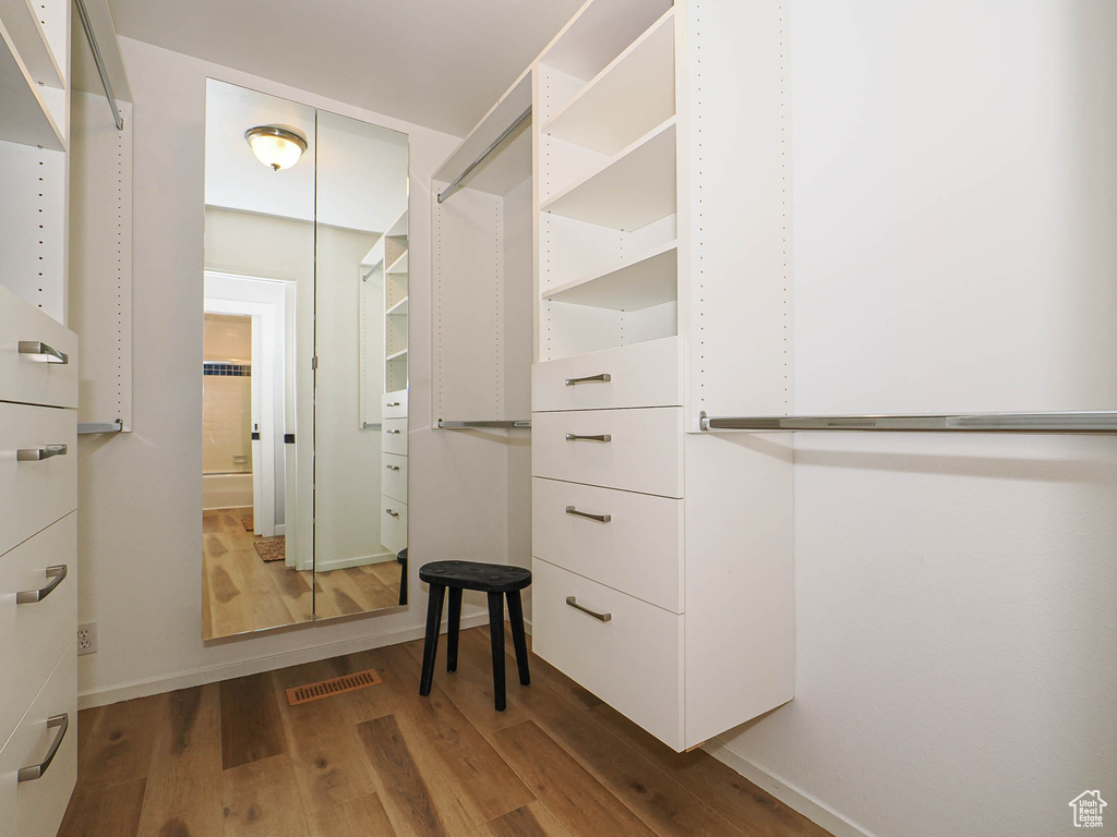 Spacious closet with wood finished floors