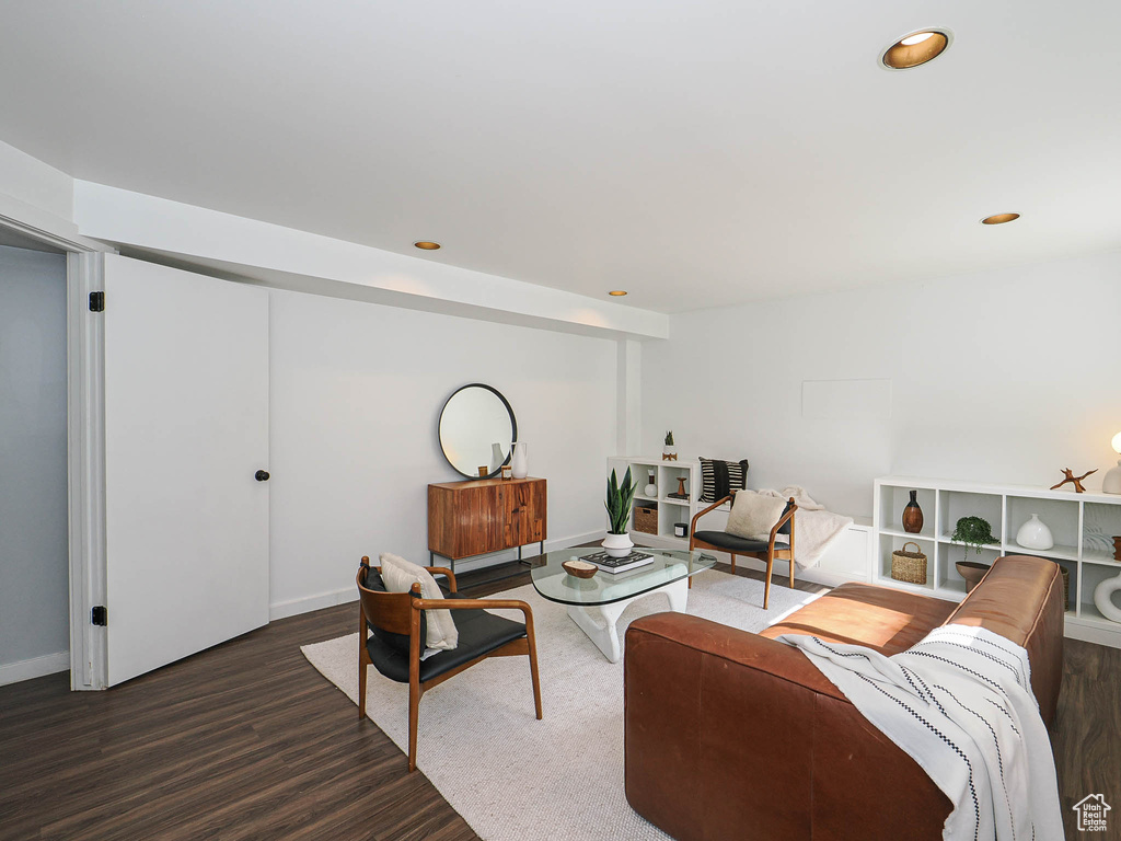 Living area featuring wood finished floors and recessed lighting