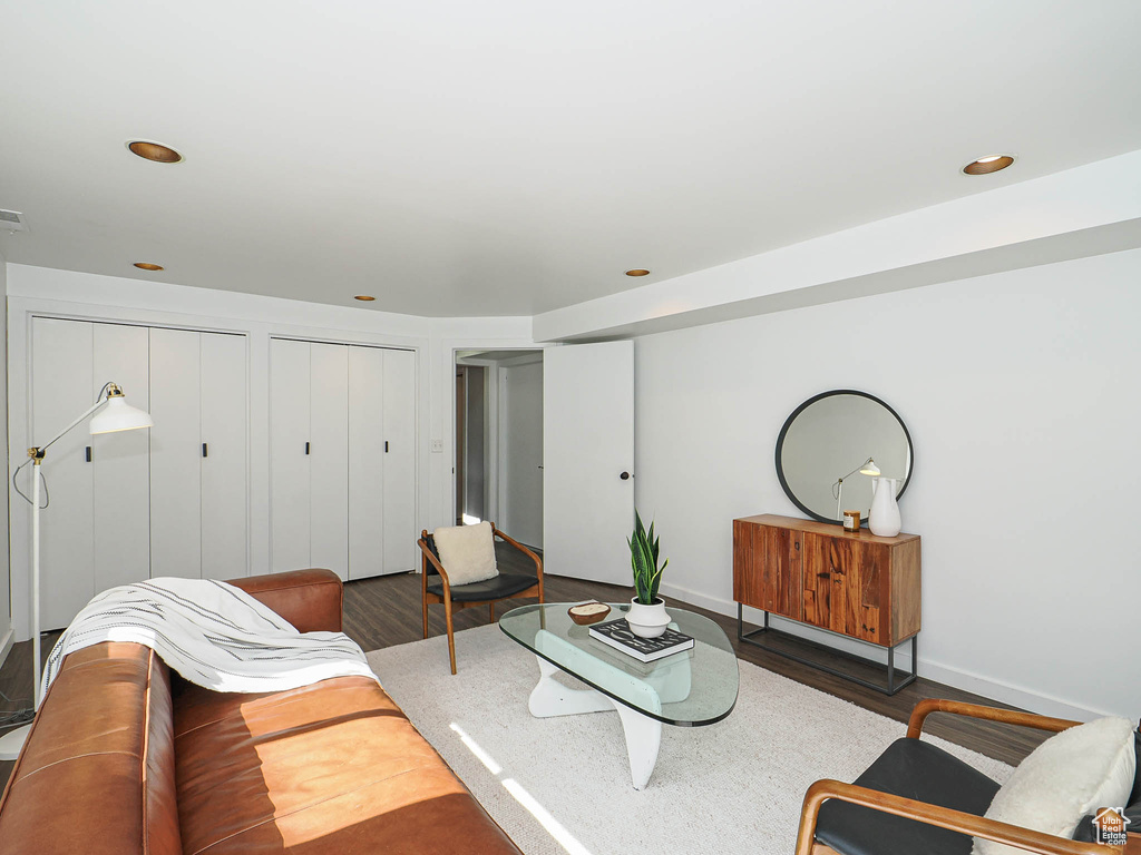 Living area featuring wood finished floors and recessed lighting