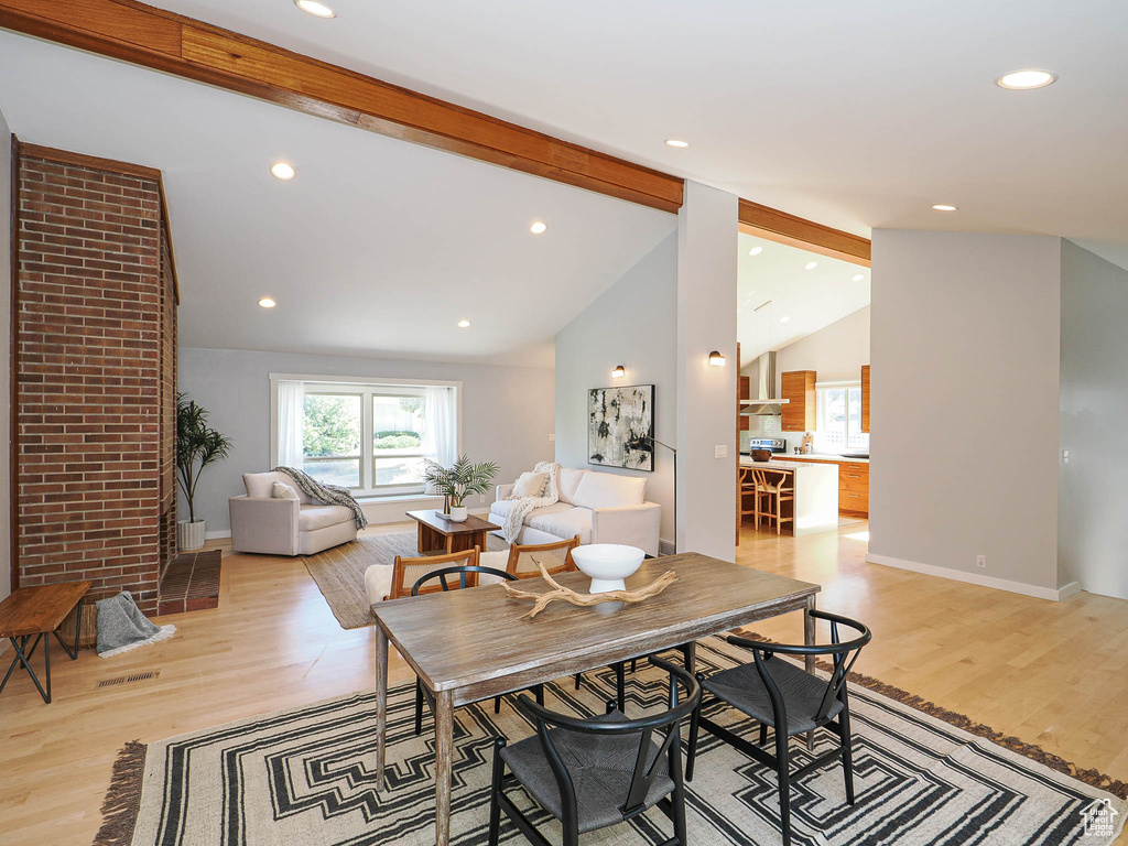 Dining room featuring light wood-type flooring and recessed lighting