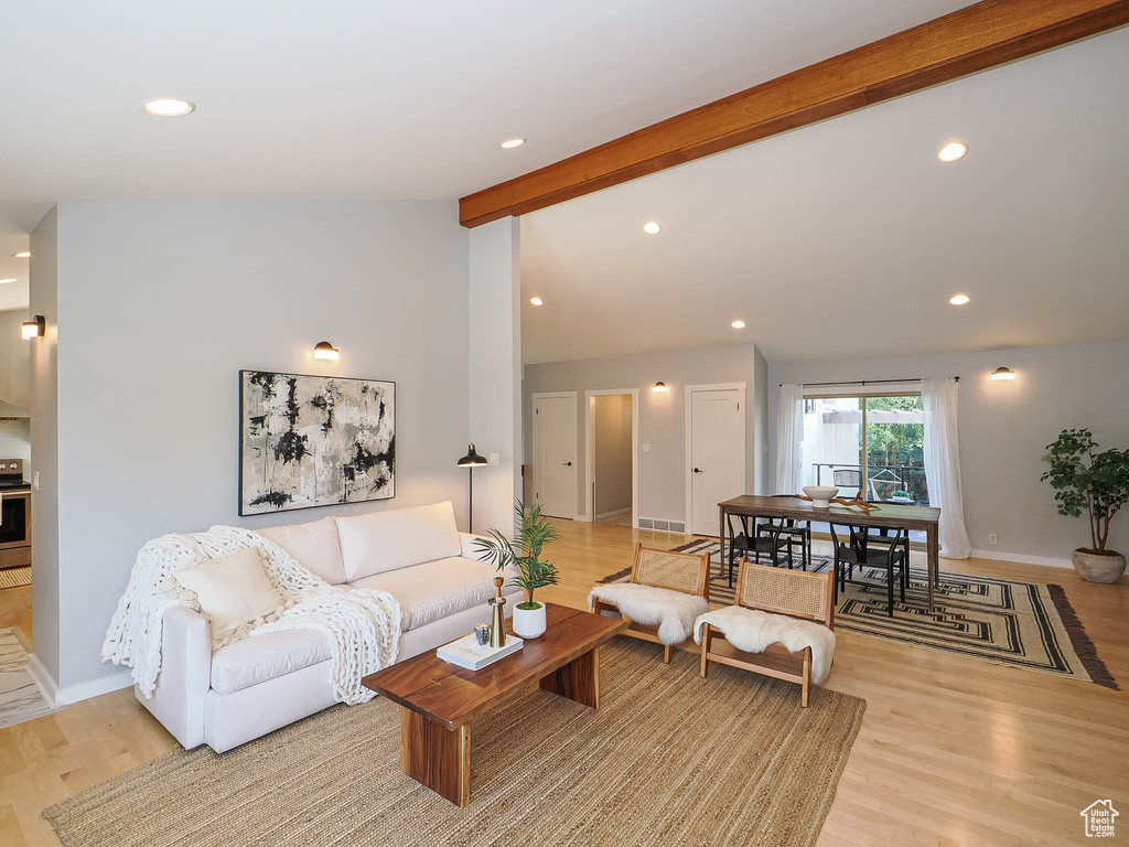 Living room featuring light wood-style flooring and recessed lighting